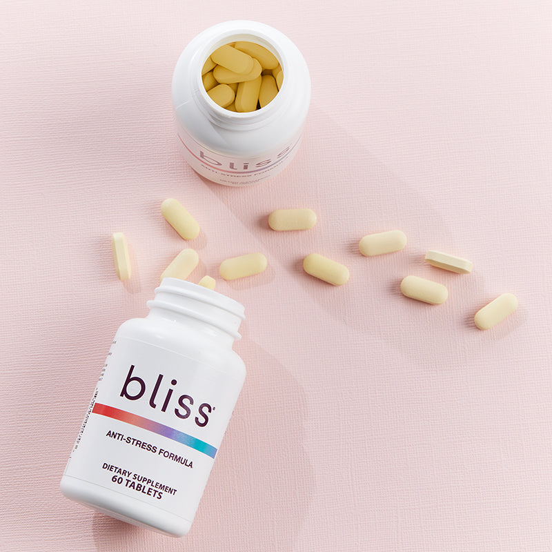 Bliss Anti-Stress Formula bottles, with caplets spillng out