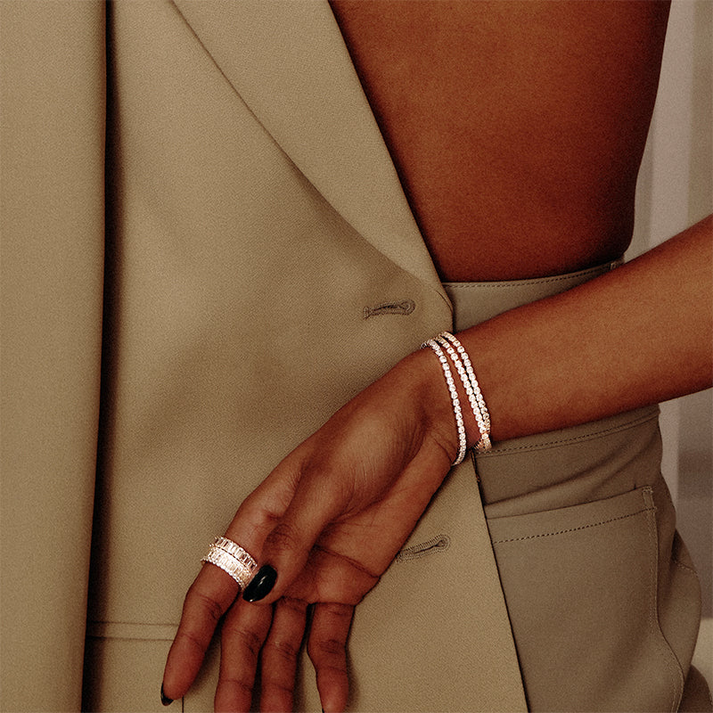 Model wearing Layered MICHAEL - Mixed Cut Eternity Band, with Layered bracelets