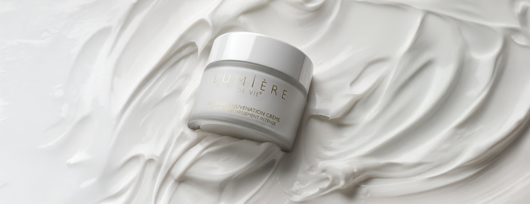 Skincare jar on a textured white background