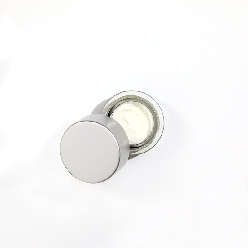 Cellular Laboratories De-Aging Eye Creme, with cap open showing creamy white product.