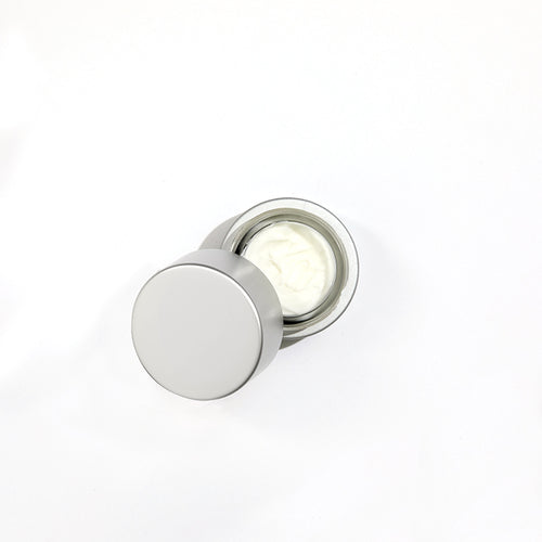 Cellular Laboratories De-Aging Eye Creme, with cap open showing creamy white product.