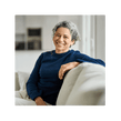 a healthy older person sitting on a couch