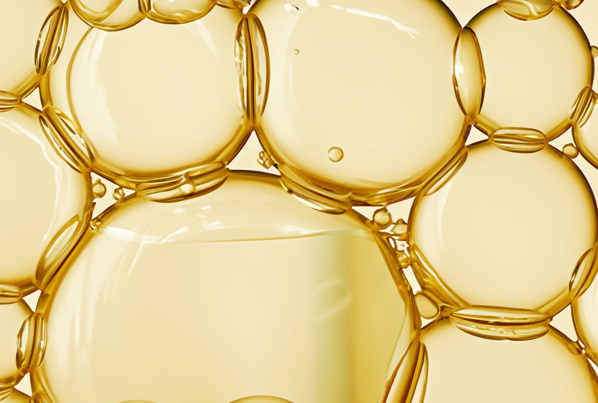 Close-up of yellow bubbles in a liquid