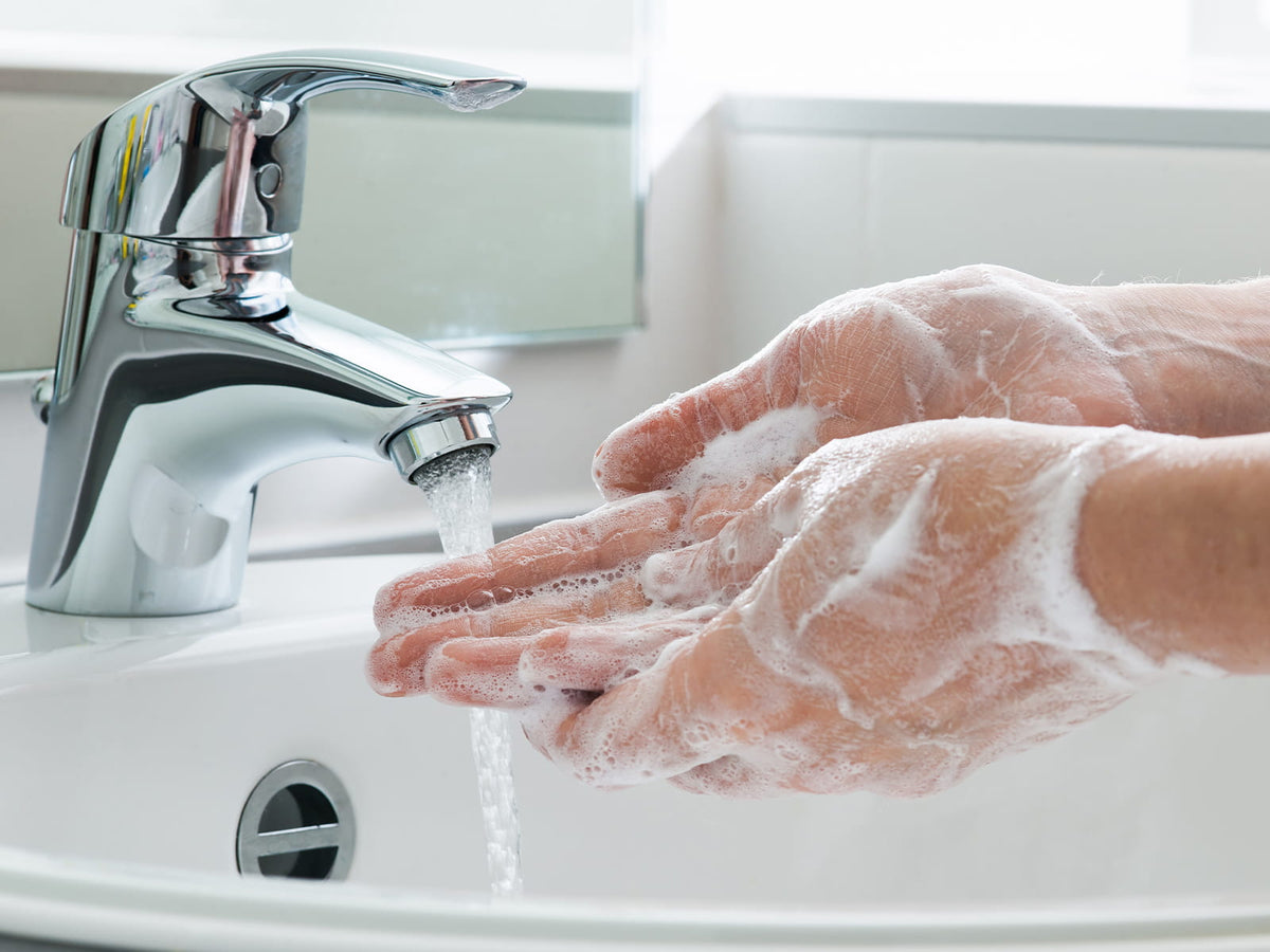 person washing hands