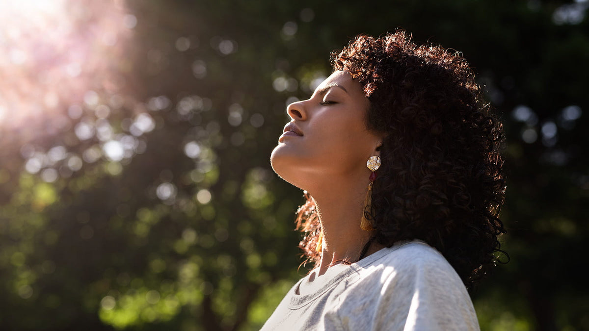 image of a woman in the sun