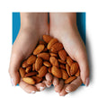 image of hands holding almonds in the shape of heart