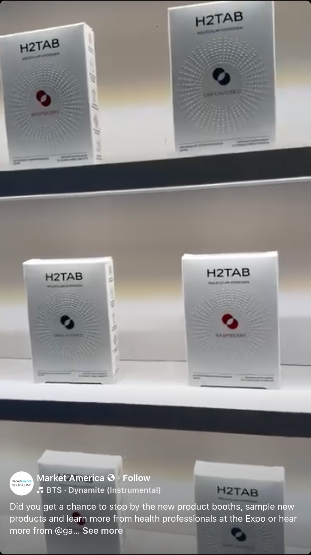 Several H2TAB product boxes displayed on white shelves. The boxes are predominantly white with a gray circular graphic and a small red circular accent in the center.