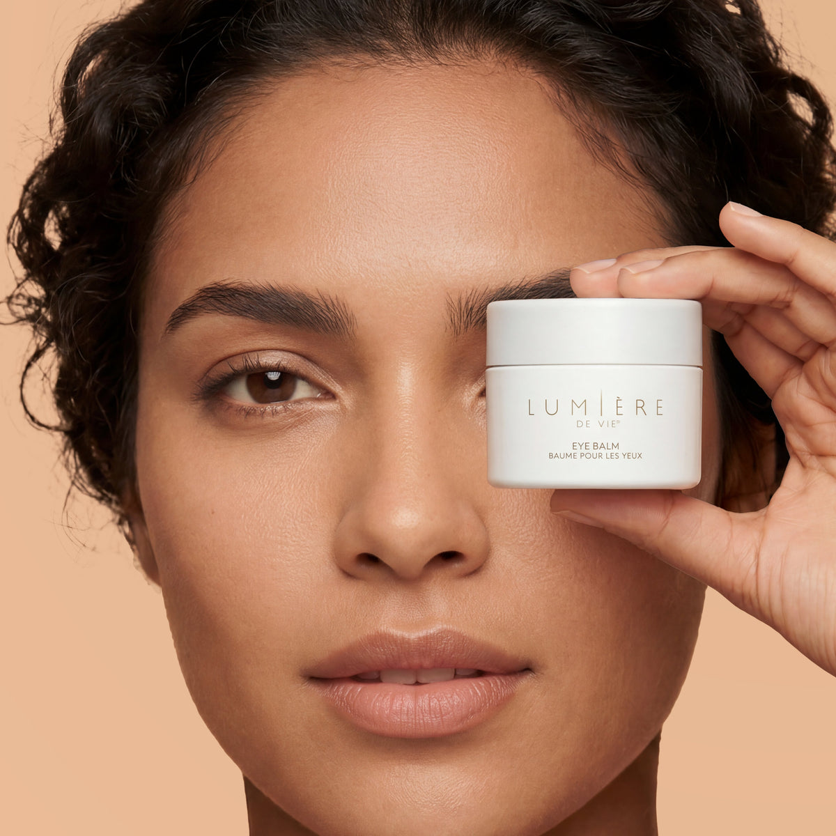 woman with eye revive gels on under eyes