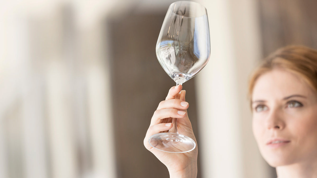 image of a woman holding a clean glass