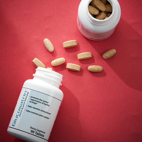 Glucosatrin Bone & Joint Health, with caplets spilled onto table