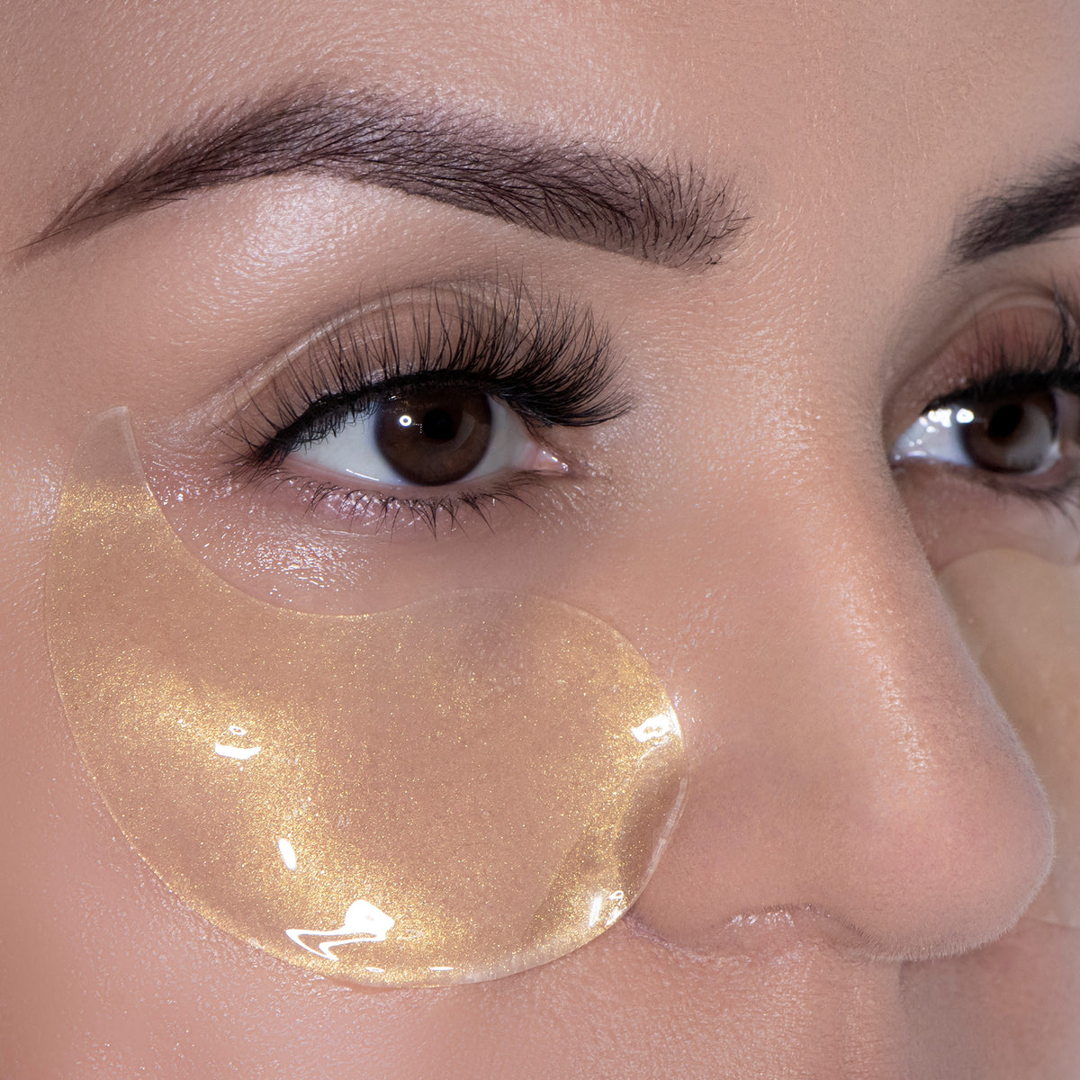 Lumière de Vie Eye Revive Gels shown placed on model under the eye
