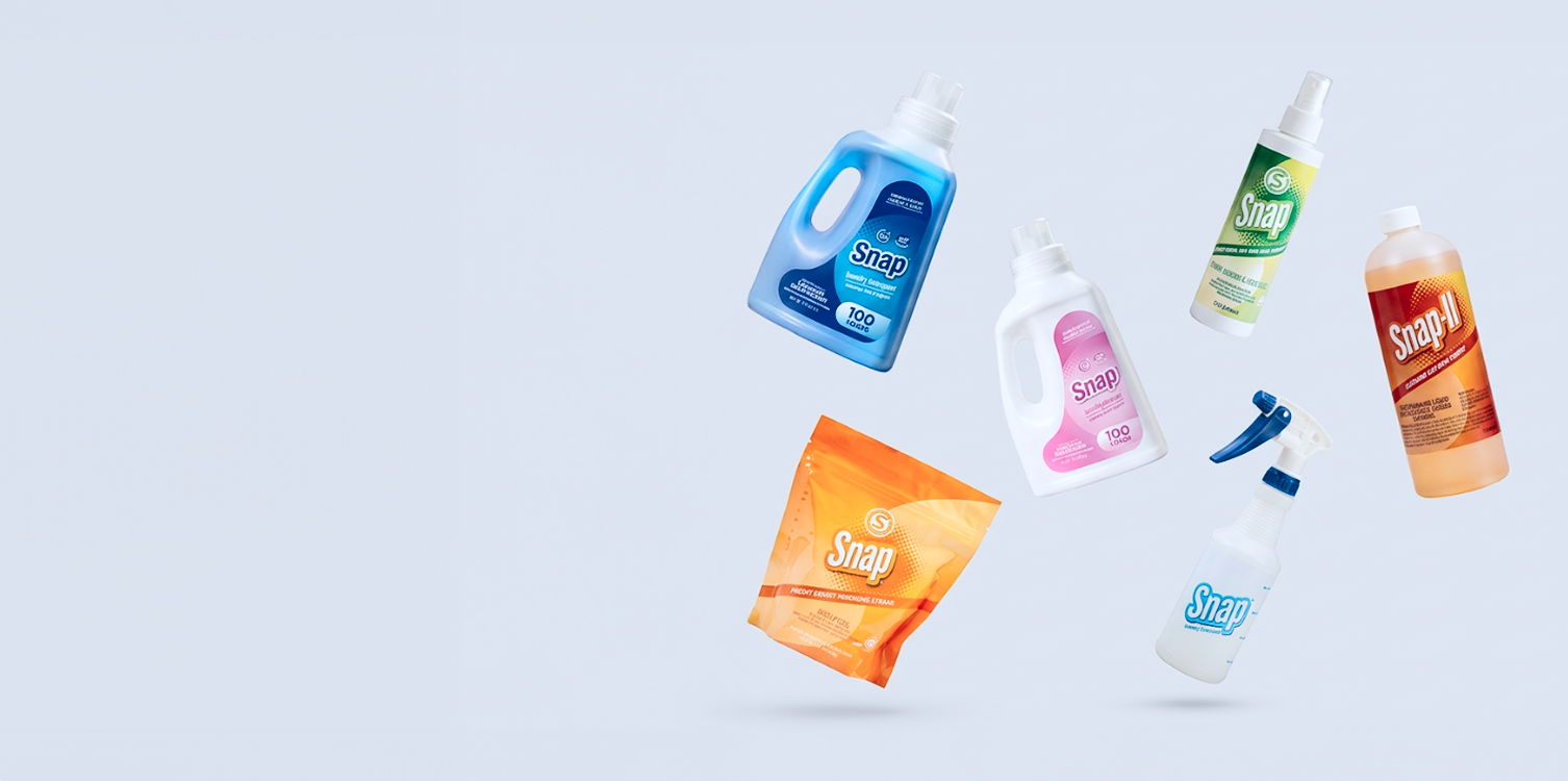 A floating arrangement of six different household cleaning products, including laundry detergent, dish soap, hand soap, and a packet of soap, set against a solid light gray background.