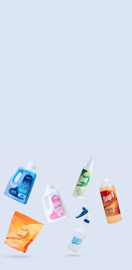 A collection of various laundry and cleaning products, including detergent bottles, a pink liquid cleaner bottle, a green spray bottle, an orange soap dispenser, a white spray bottle, and an orange soap bag, floating against a solid light blue background.