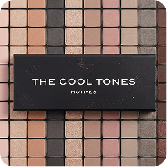 A rectangular black makeup palette box labeled 'THE COOL TONES MOTIVES' placed over a grid of square eyeshadow pans in neutral shades.