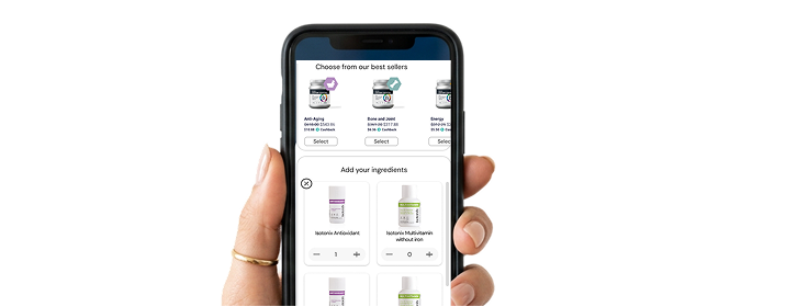 Hand holding a smartphone displaying a skincare product selection app on a white background