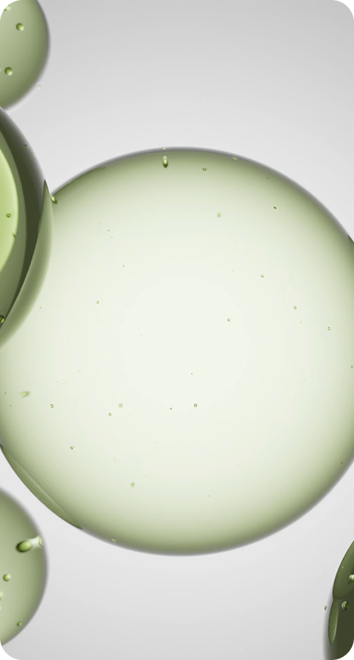 Close-up of green macaron cookies on a light gray background