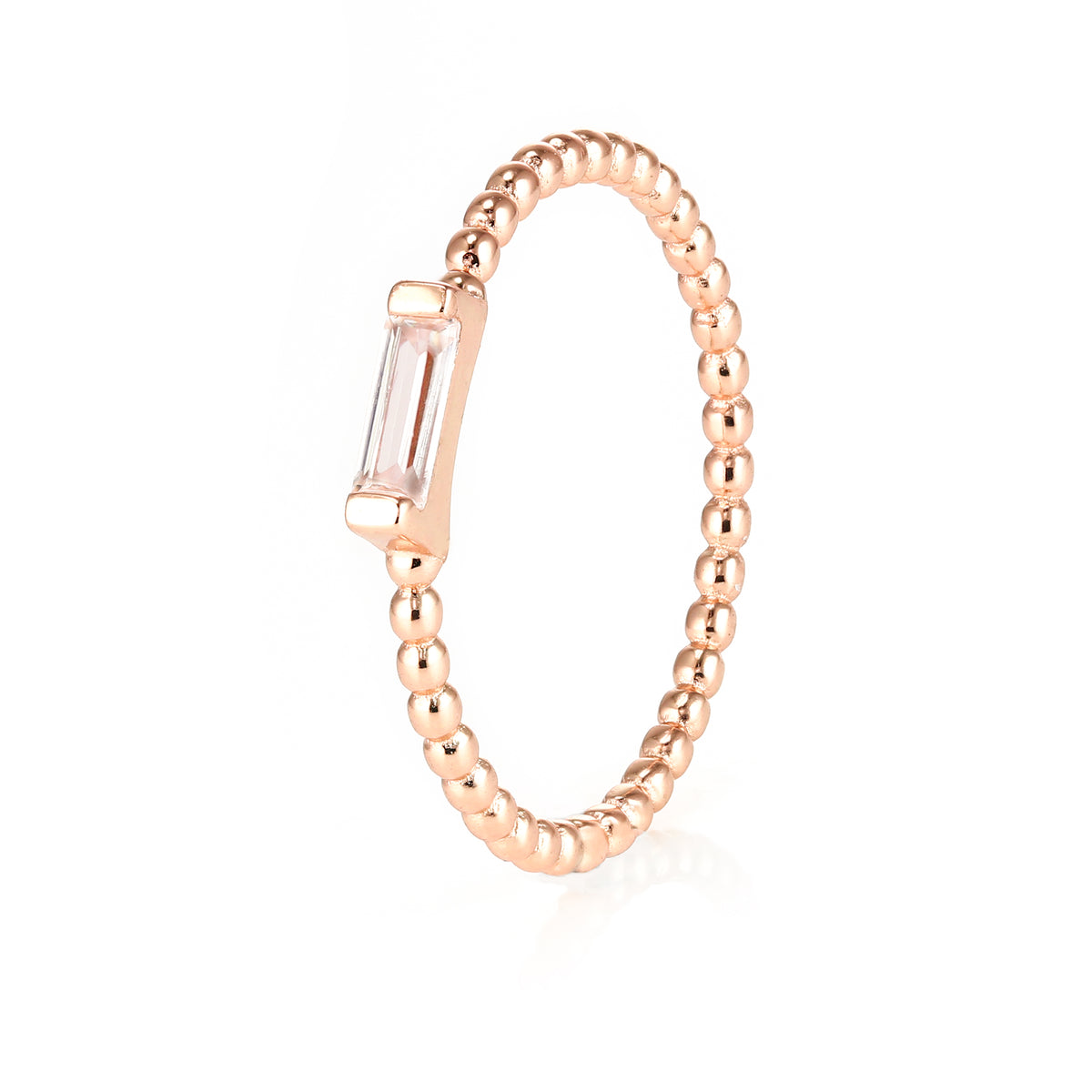 Closeup of Layered Adrienne - Spiraled Baguette Ring, Rose Gold with clear gem, angled view