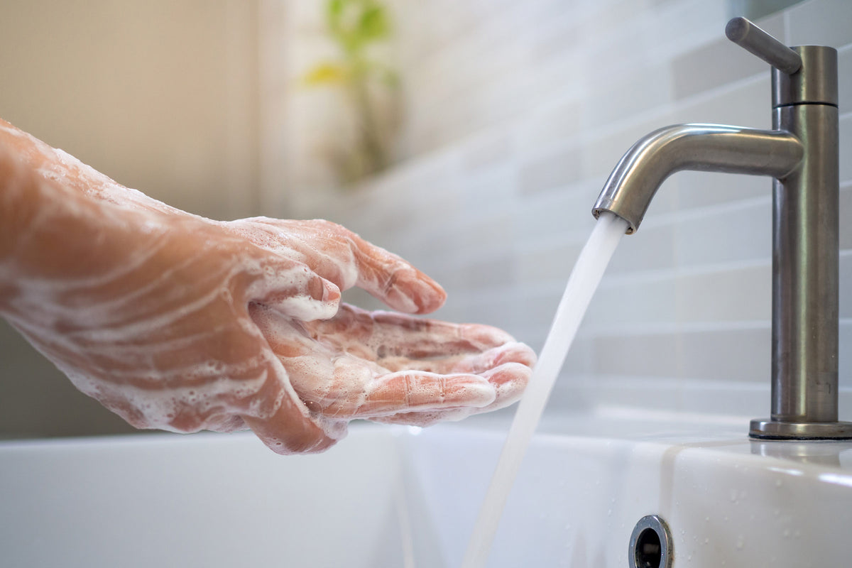 image of someonne washing their hands