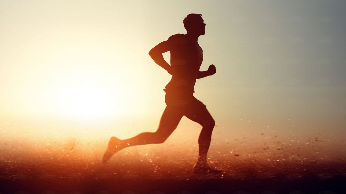 image of man running gin the sun