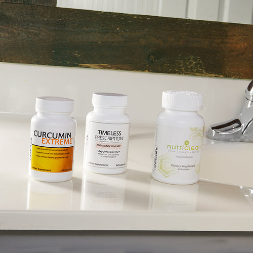 Complete Detoxification Kit: Timeless Prescription Oxygen Extreme™, Curcumin Extreme™, and NutriClean HepatoCleanse, on white bathroom counter