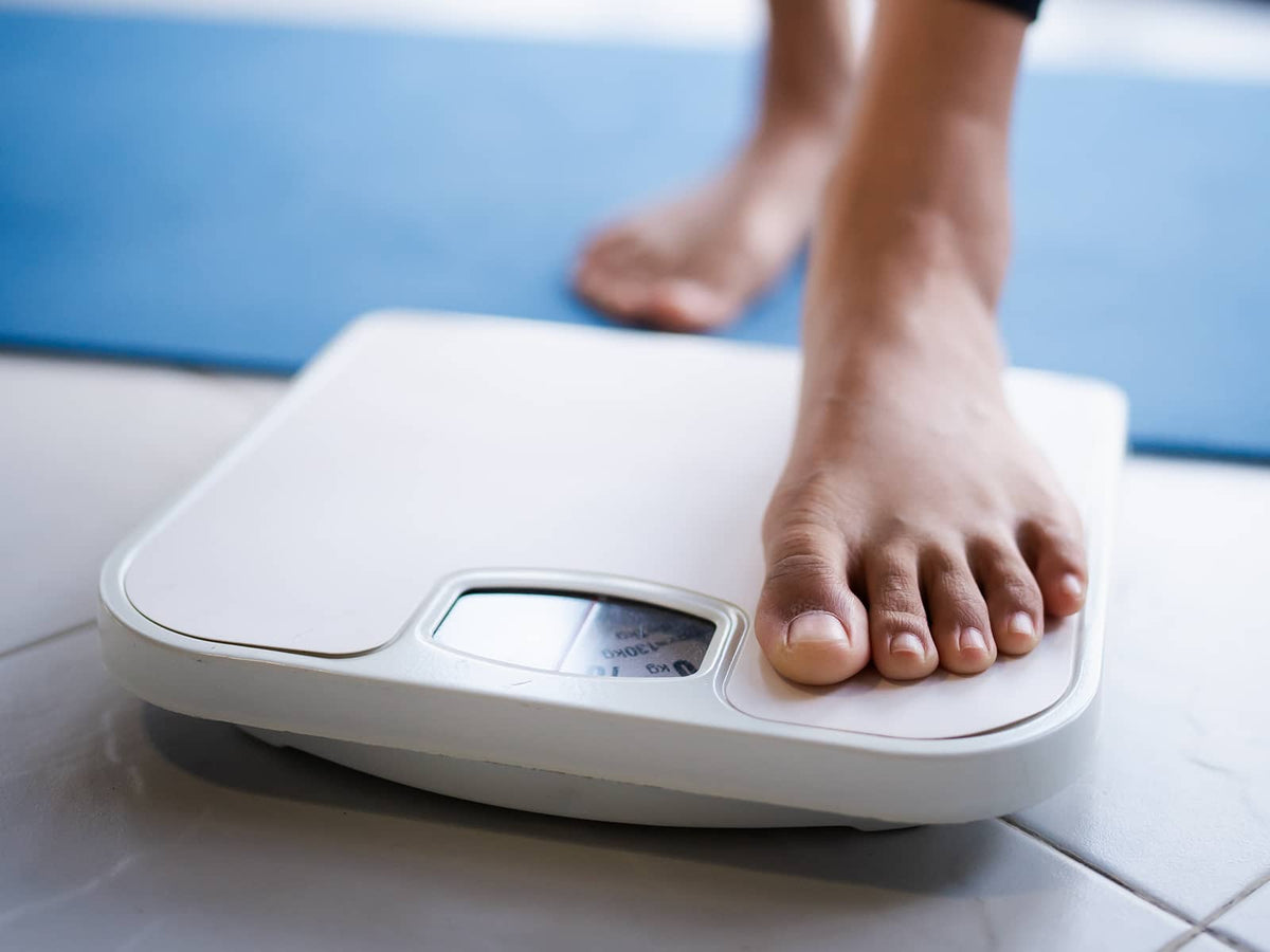 image of a person standing on a scale