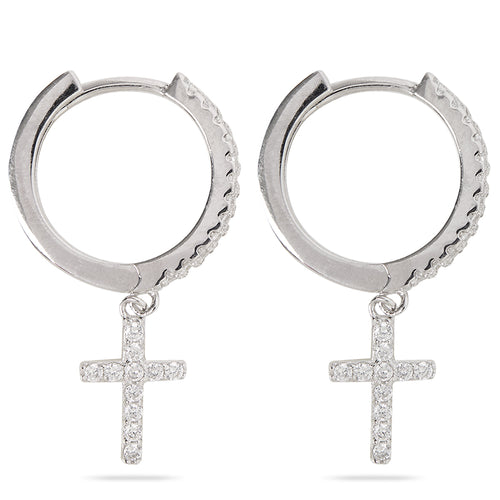 Closeup of Layered Brandi - Cross Huggie Earrings in silver, side view