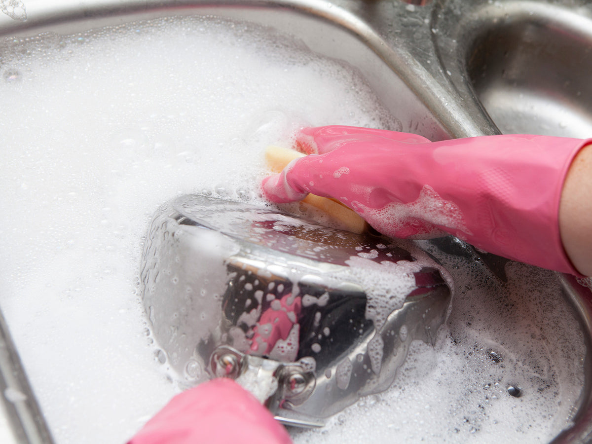 image of someone washing a pan