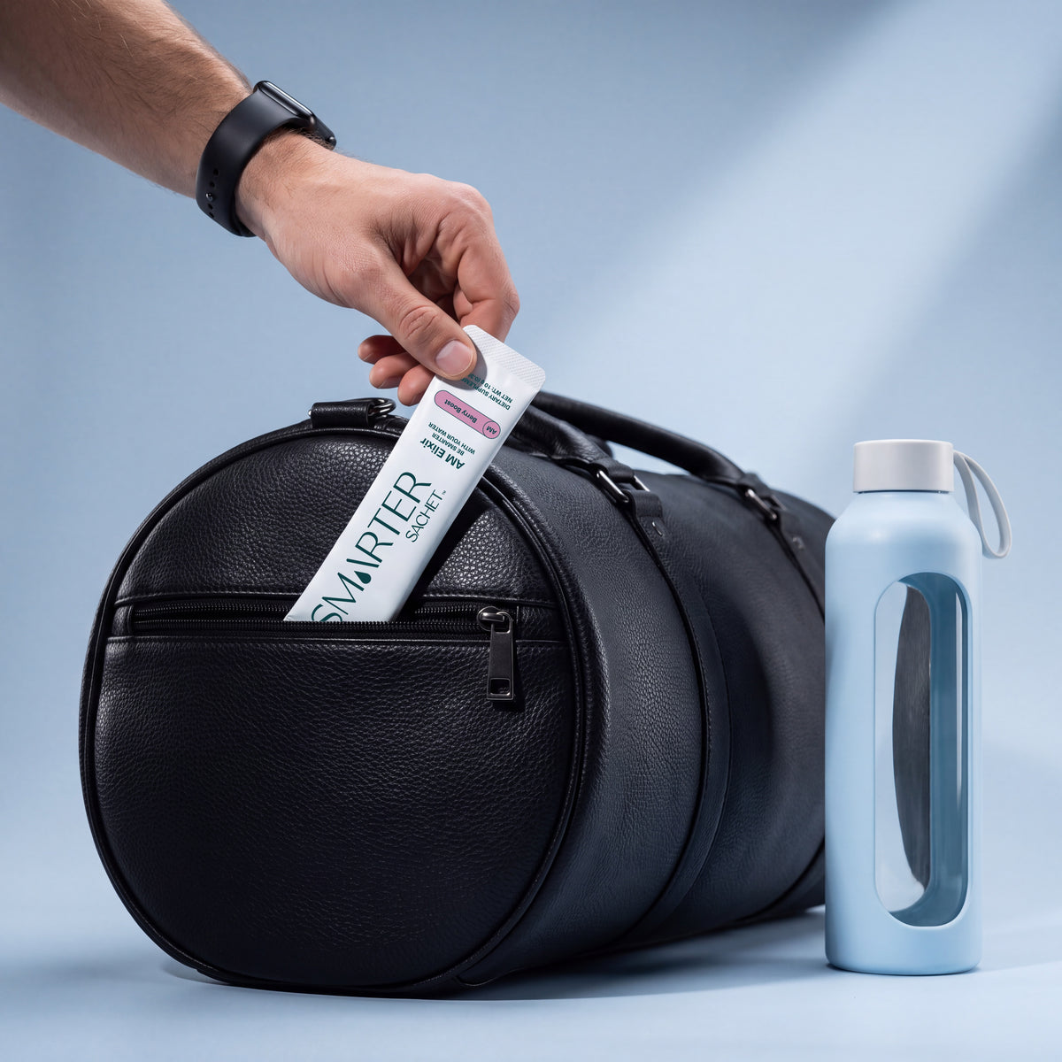 Man putting a sachet into a gym bag.