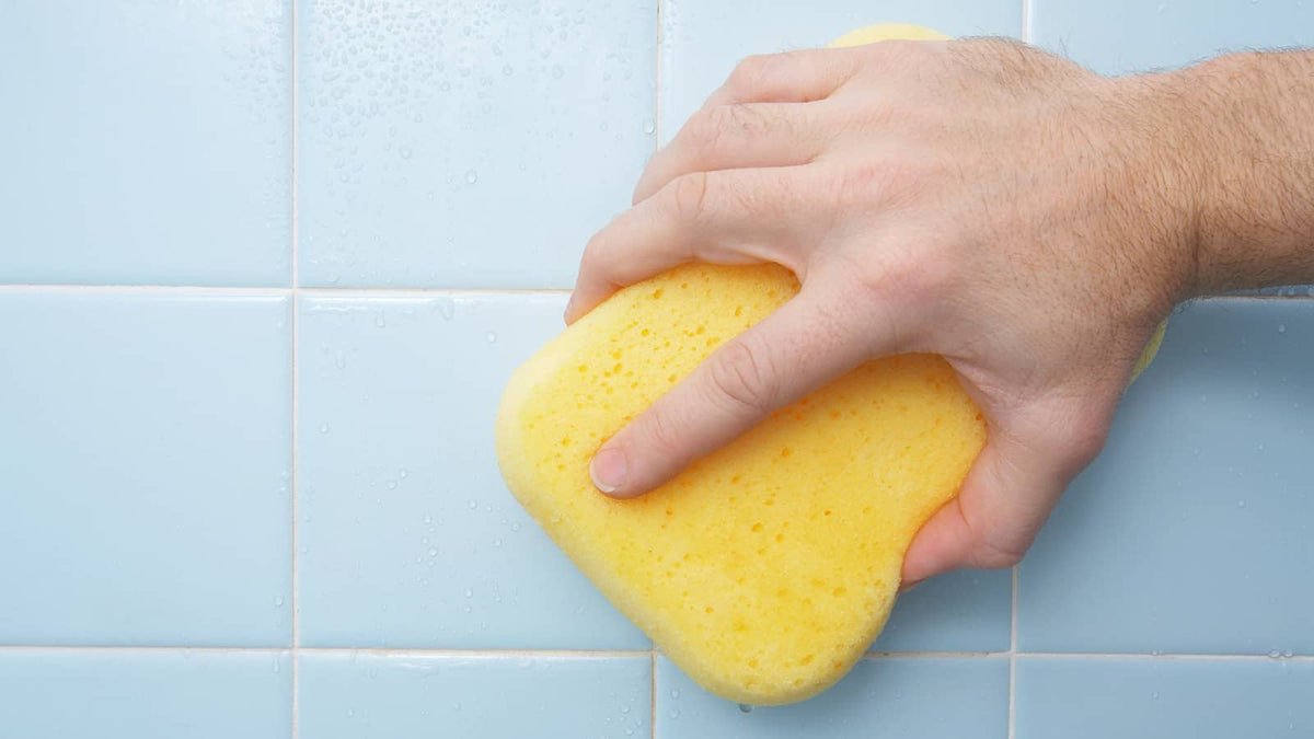image of someone cleaning the tile