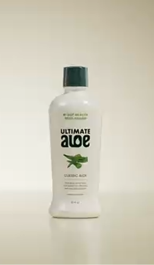 Bottle of Ultimate Aloe on a beige background