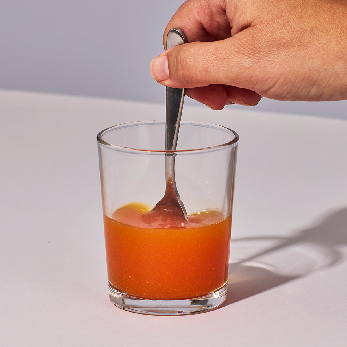 image of person mixing up Isotonix Vision with Lutein powder with water
