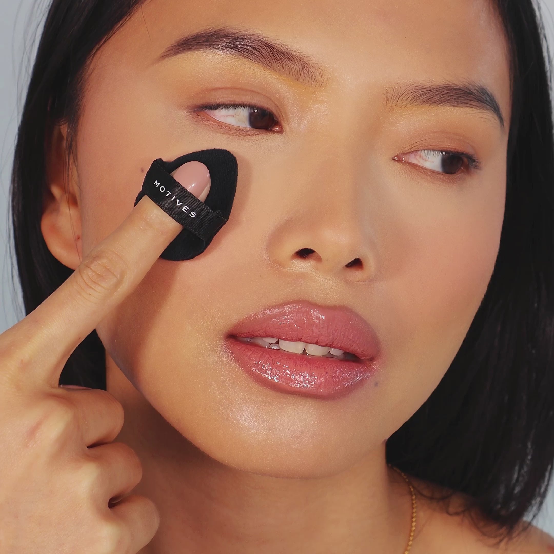women is showing setting powder jar