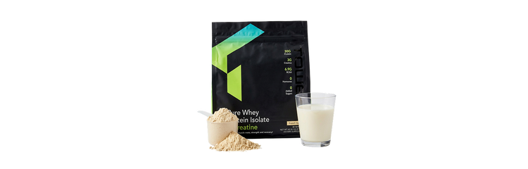 Whey protein isolate package with scoop and glass of milk on a white background