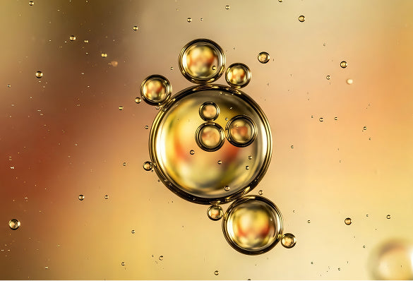 Gold bubbles on a gradient background