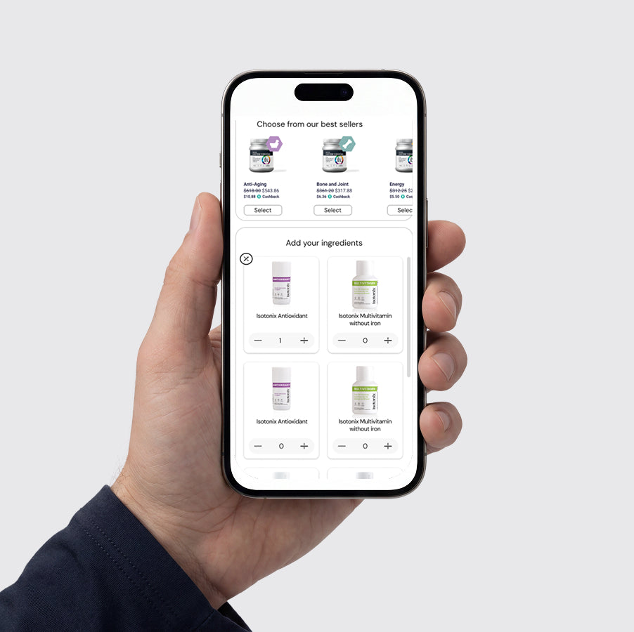 A hand holding a smartphone that displays a skincare app interface with product cards. The background is a clean, light gray studio backdrop.