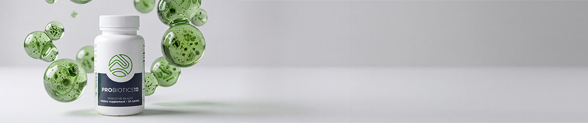 A white supplement bottle labeled PROBIOTICID with green liquid droplets floating around it on a light gray background.